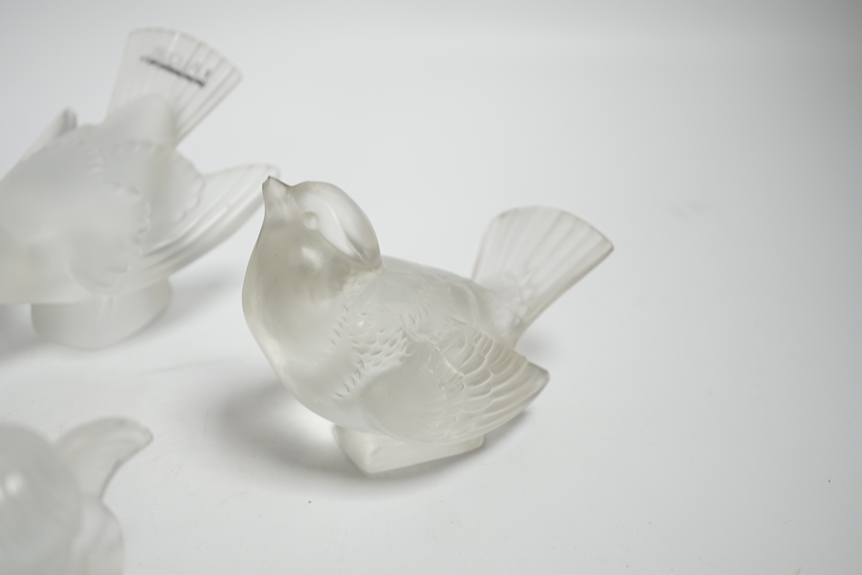 Four Lalique glass paperweights, three boxed
